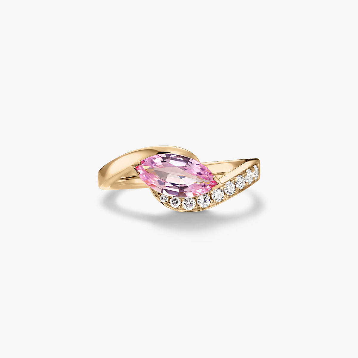 14K yellow gold ring with a marquise-cut pink sapphire and pavé natural diamonds on a wrap band, isolated on a white background.