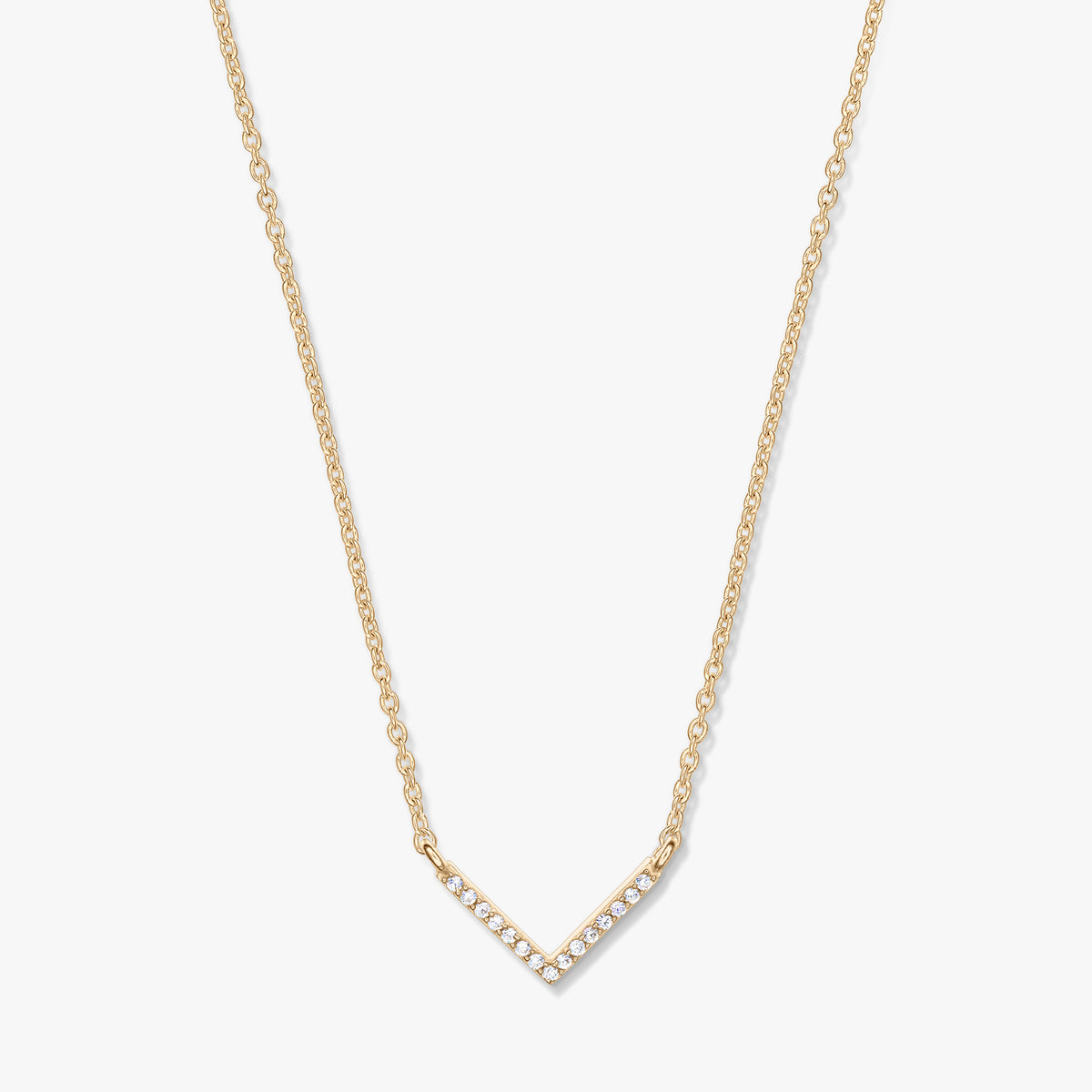 Golden V-shaped zirconia pendant necklace on a delicate chain, photographed on a white background.