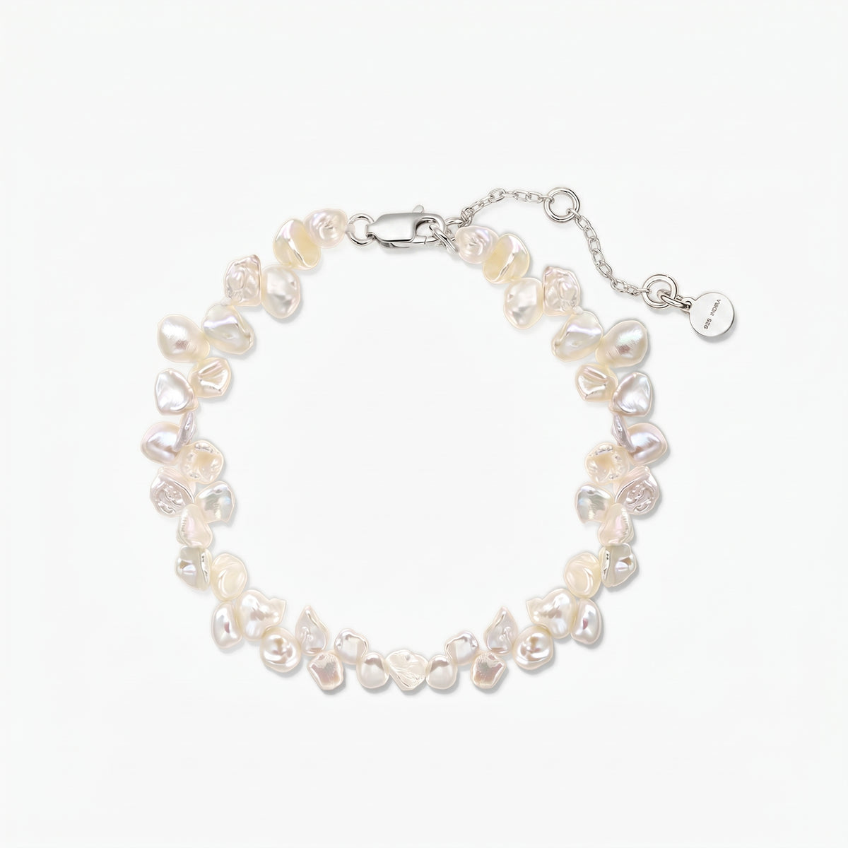 Adjustable keshi freshwater pearl bracelet with a rhodium‑plated 925 silver lobster clasp and extender chain on a white background.