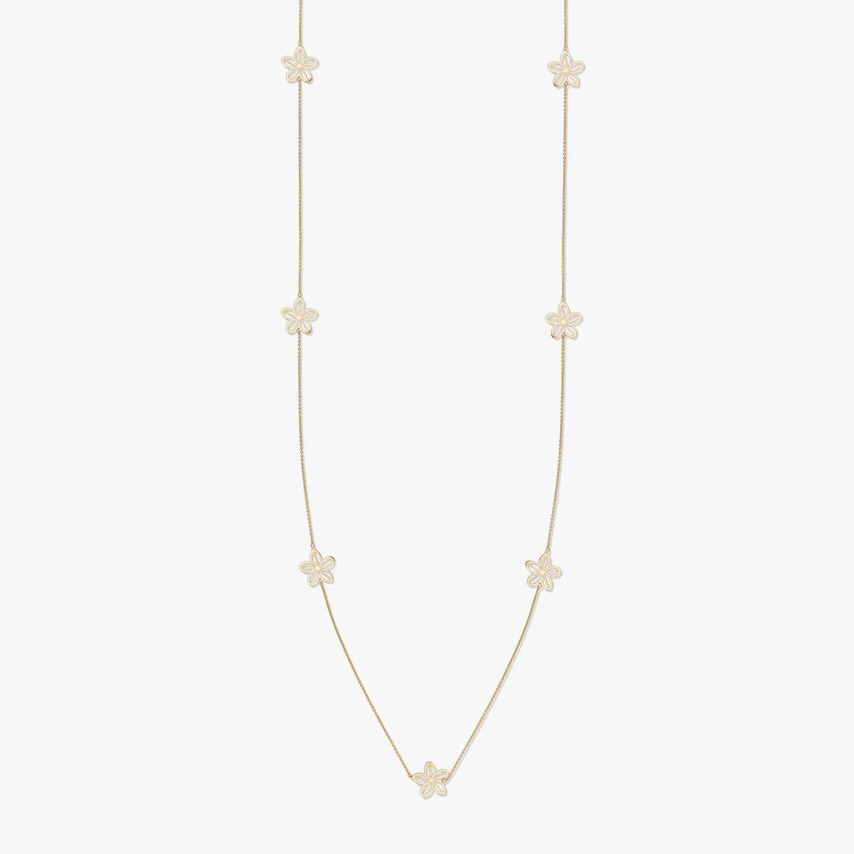 Gold necklace with floral motifs on a white background