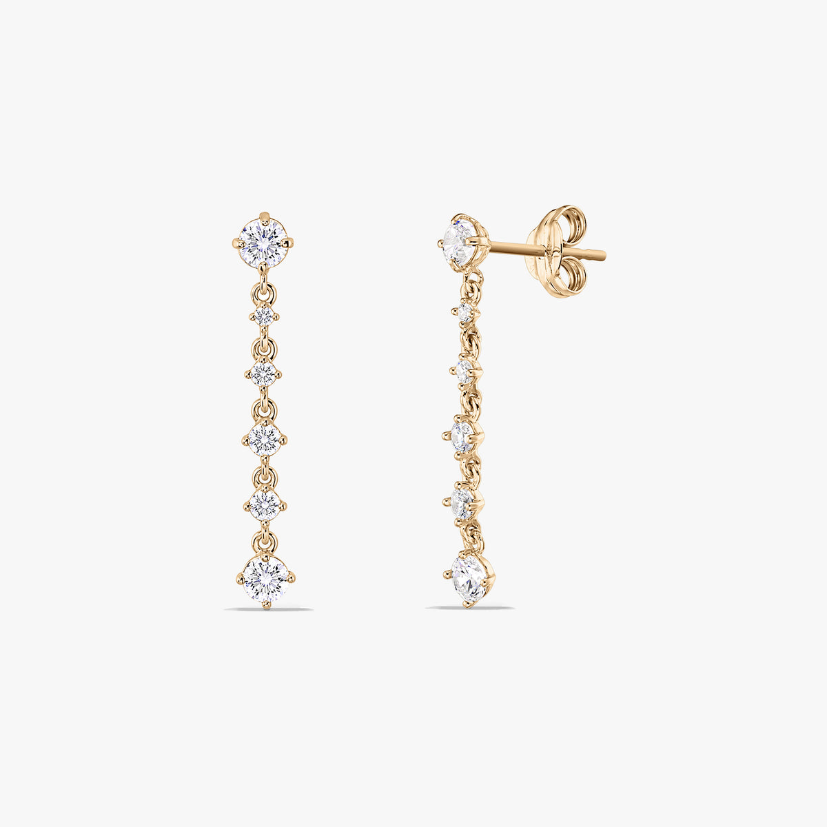 Pair of 14K yellow gold drop earrings with a vertical line of round white cubic zirconia; one earring shown front-on and the other angled to show the stud post and butterfly back on a white background.