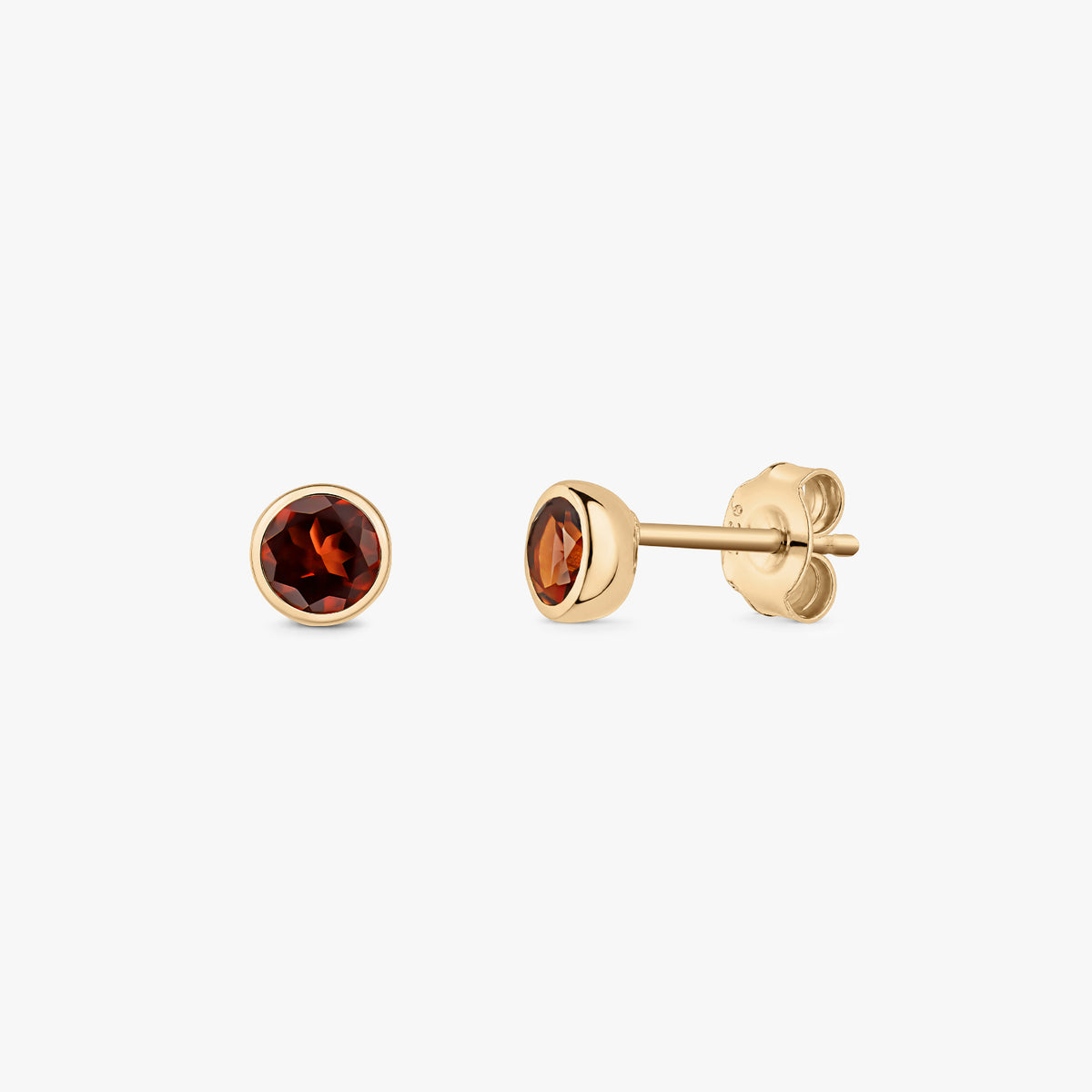 Pair of gold-plated sterling silver stud earrings with round faceted garnet birthstones, bezel set with butterfly backs, on a white background.