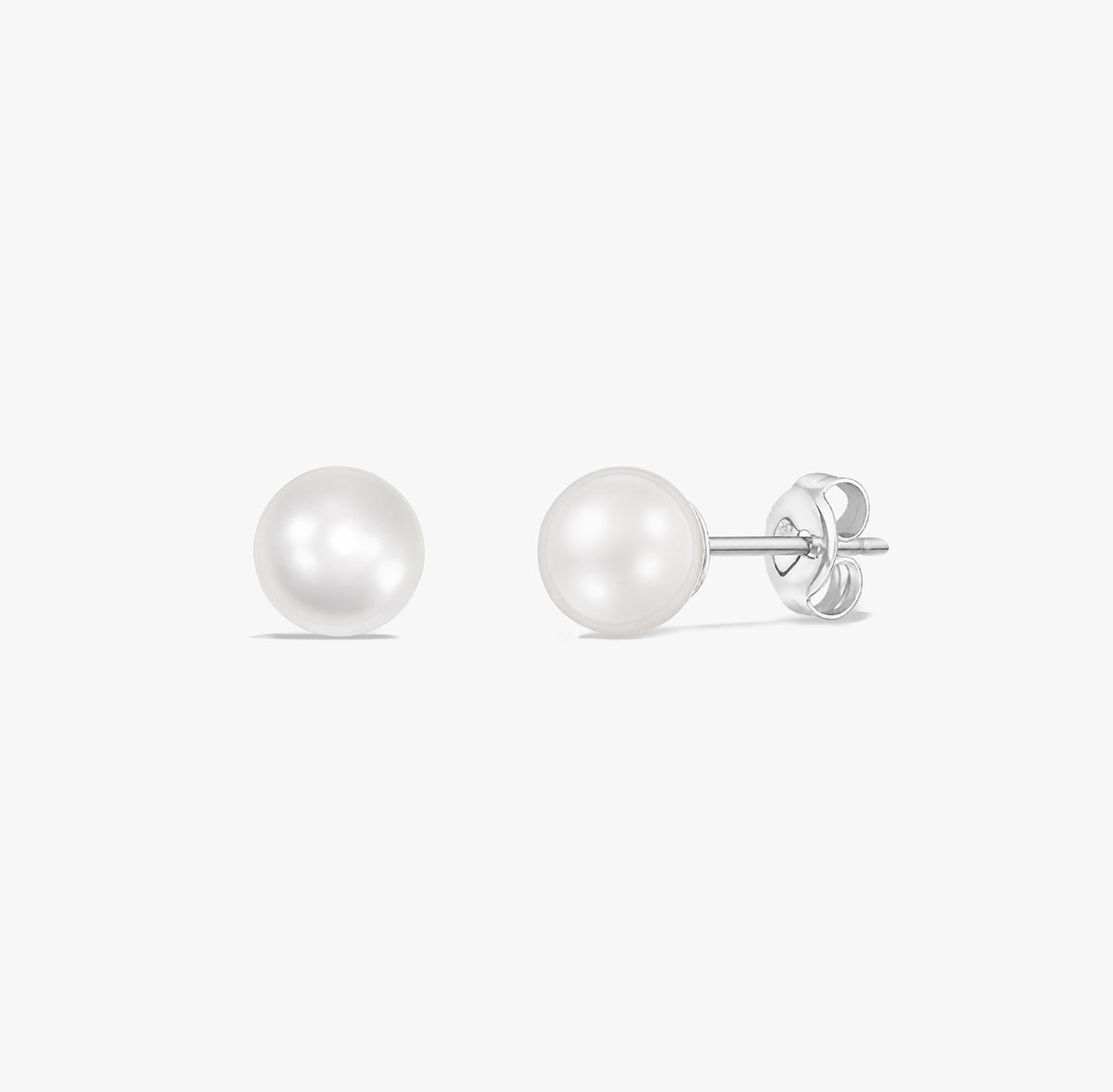 Pair of classic pearl stud earrings with natural white pearls set in 925 sterling silver on a white background.