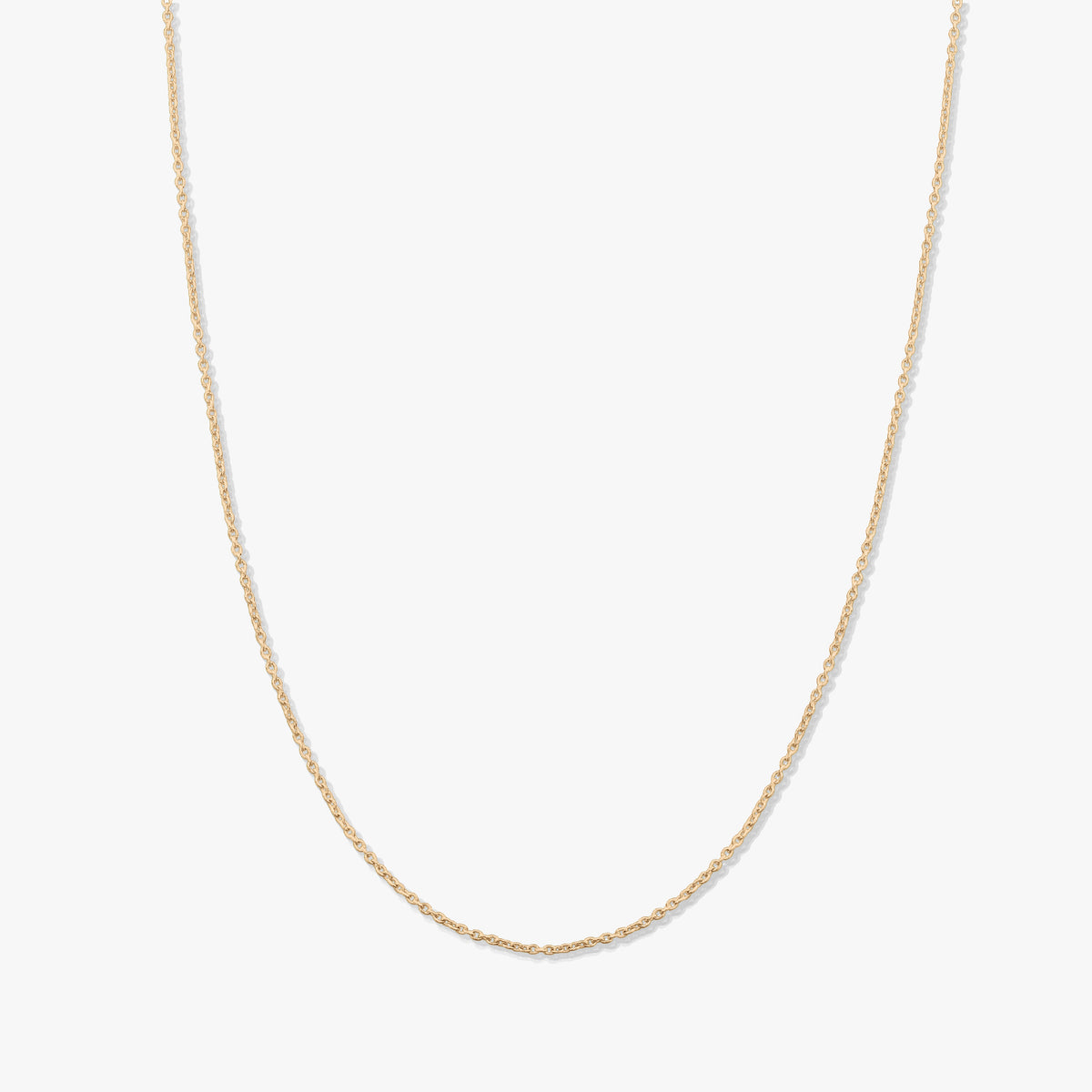 Delicate yellow gold chain necklace with fine links, shown on a white background without a pendant.