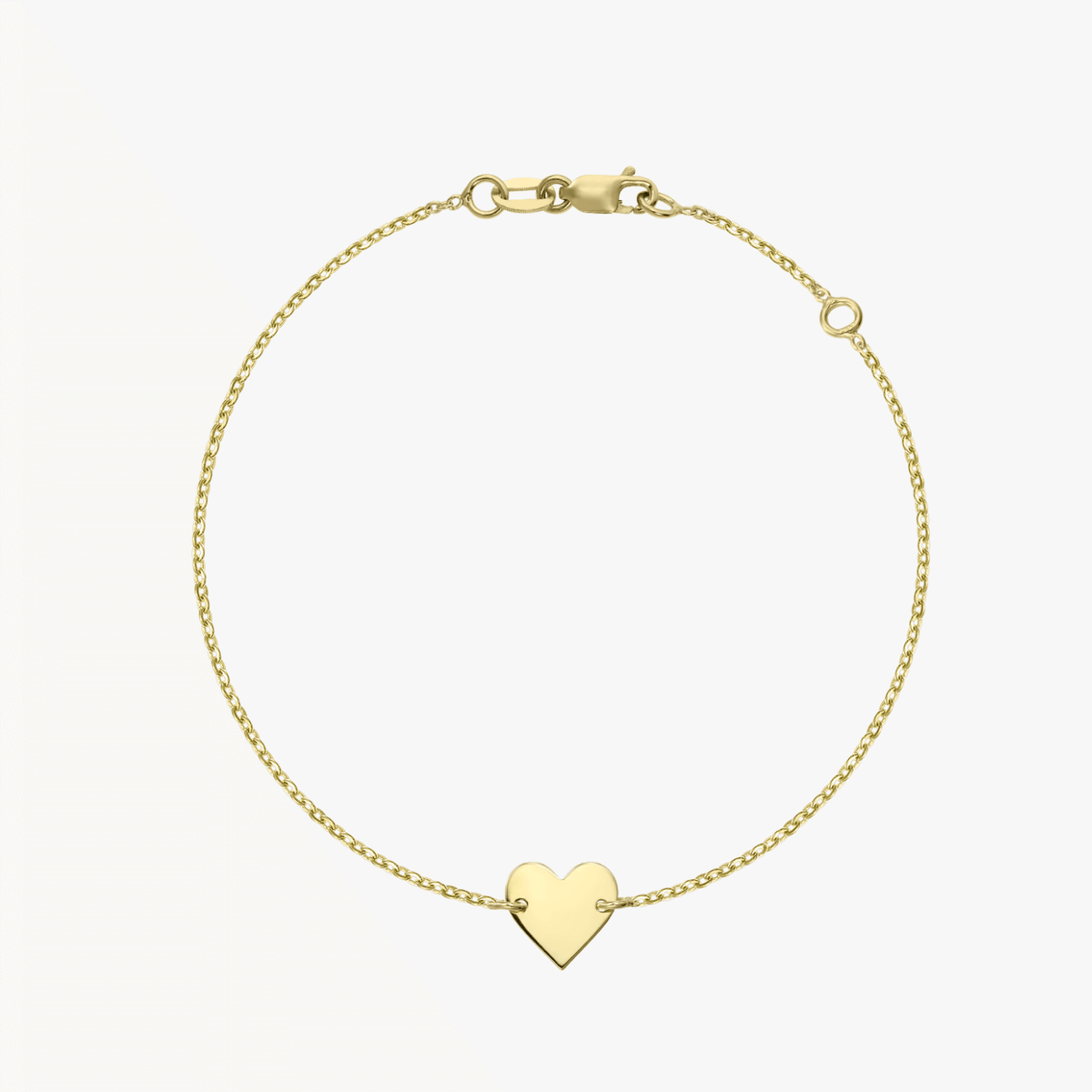 14K gold heart bracelet on a white background