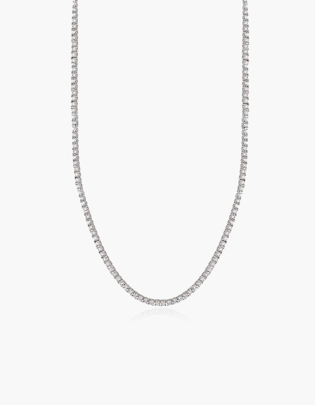 Silver tennis necklace with zirconia stones on a white background.