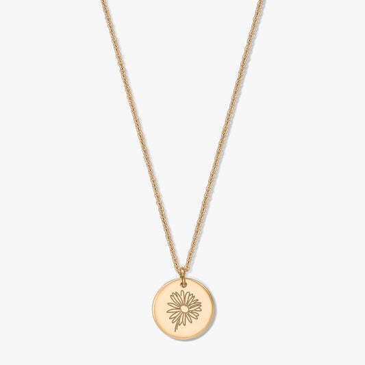 Gold‑plated silver necklace with a round disc pendant engraved with a daisy, shown centered on a white background.