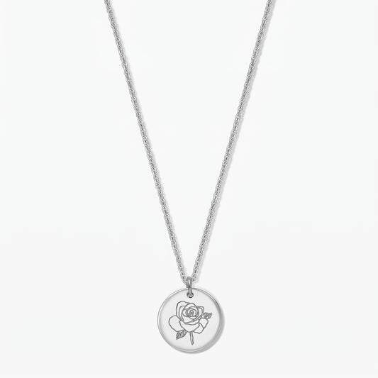 Sterling silver birthflower necklace with a round pendant engraved with a rose (June), photographed on a white background.