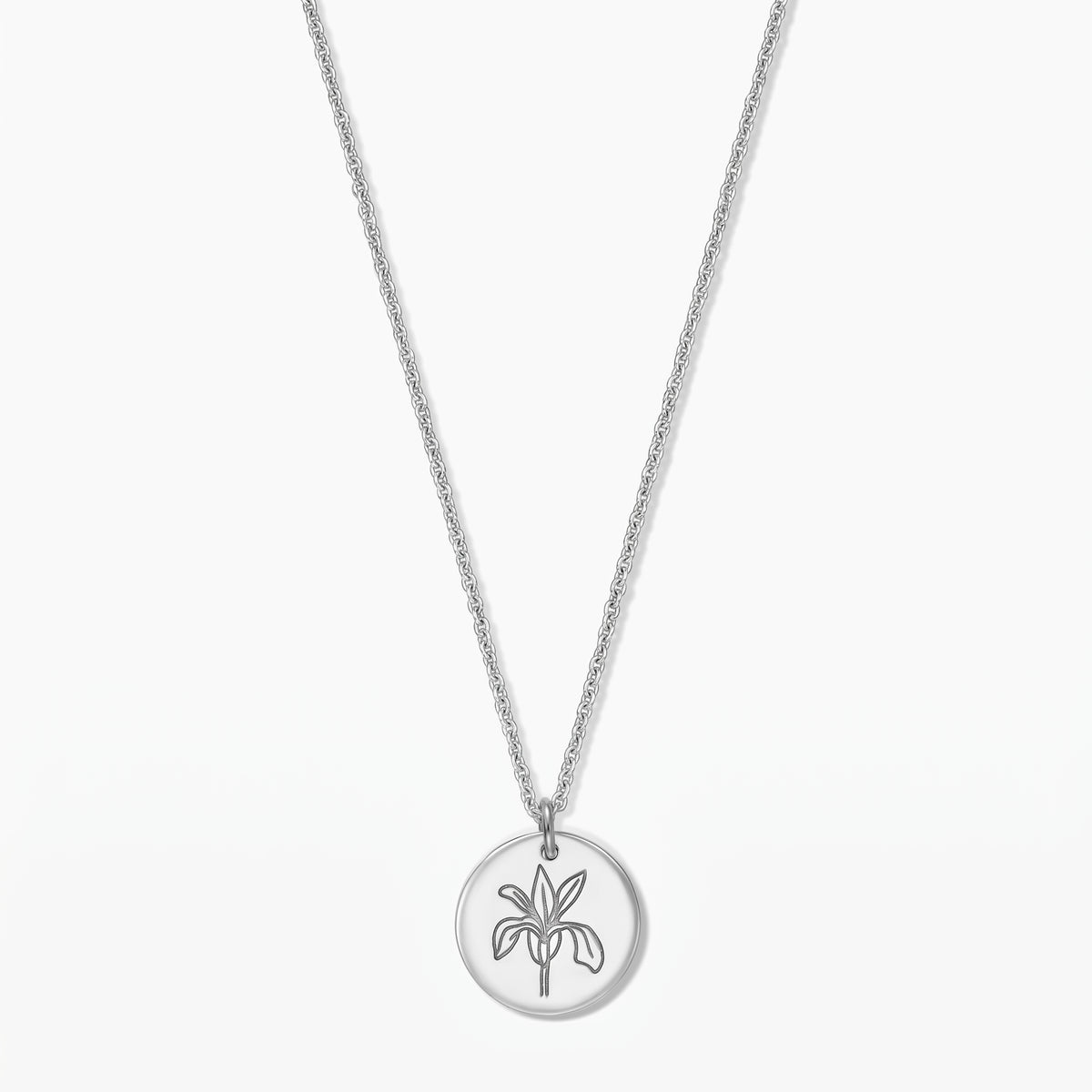 Sterling silver necklace with a round pendant featuring an iris line-art motif on a white background.