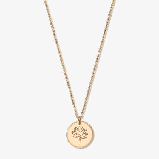 Gold-plated silver birthflower necklace with a round disc pendant engraved with a lotus (July) on a white background.