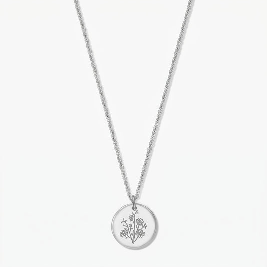 Birthflower Silver Necklace – September aster engraved round pendant in 925 silver on a delicate chain, isolated on a white background.