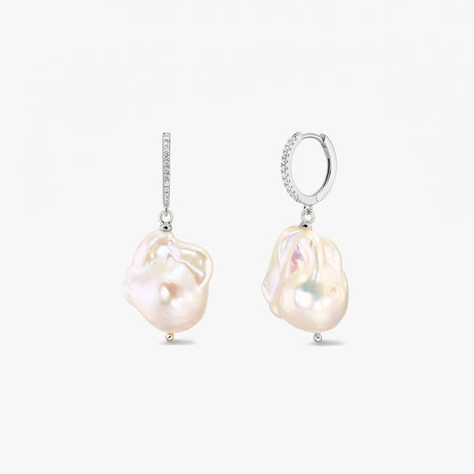 Pair of rhodium‑plated 925 silver hoop earrings with pavé zirconia and large organic baroque pearls on a white background.