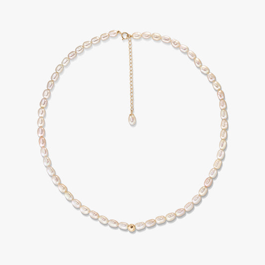 Blair gold necklace with natural oval pearls arranged in a circle on a white background, featuring a 14K gold clasp, extender chain, and a small gold accent bead.