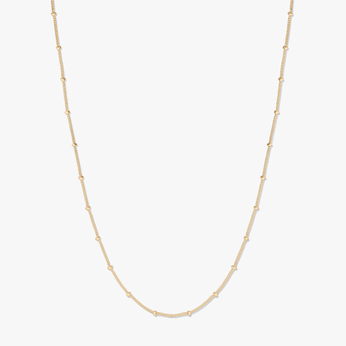 Gold-plated silver beaded chain necklace displayed on a white background, forming a gentle U shape with small bead stations along the chain.