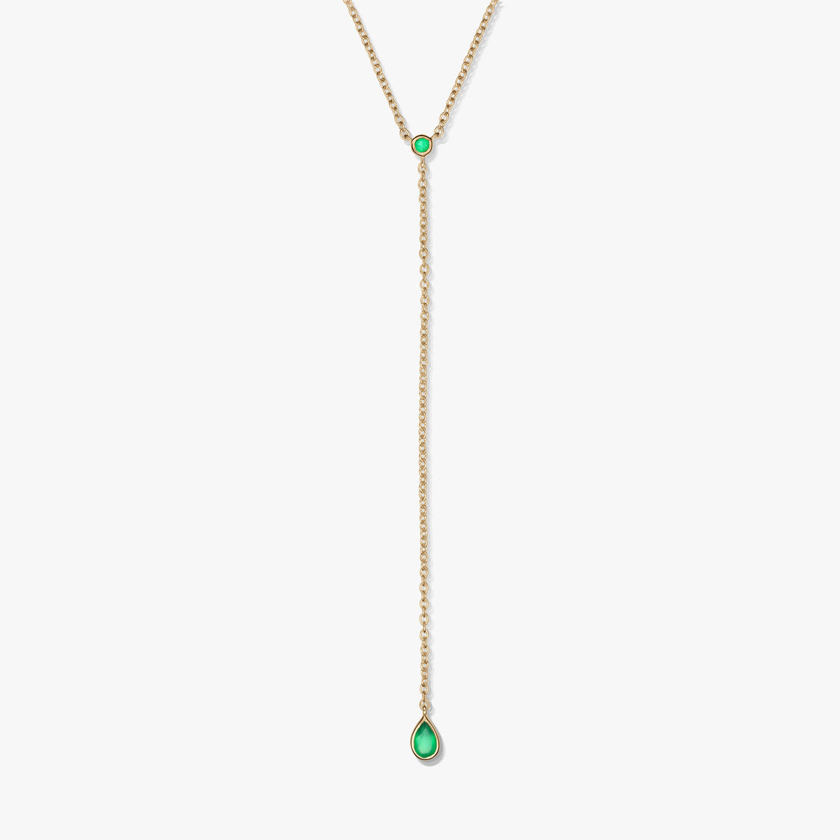 Gold-plated sterling silver lariat necklace with green onyx accents and a teardrop drop pendant, photographed on a white background.