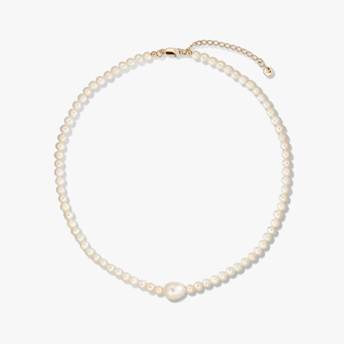 Golden Chanti silver necklace with white cultured pearls and an adjustable extender chain on a white background.