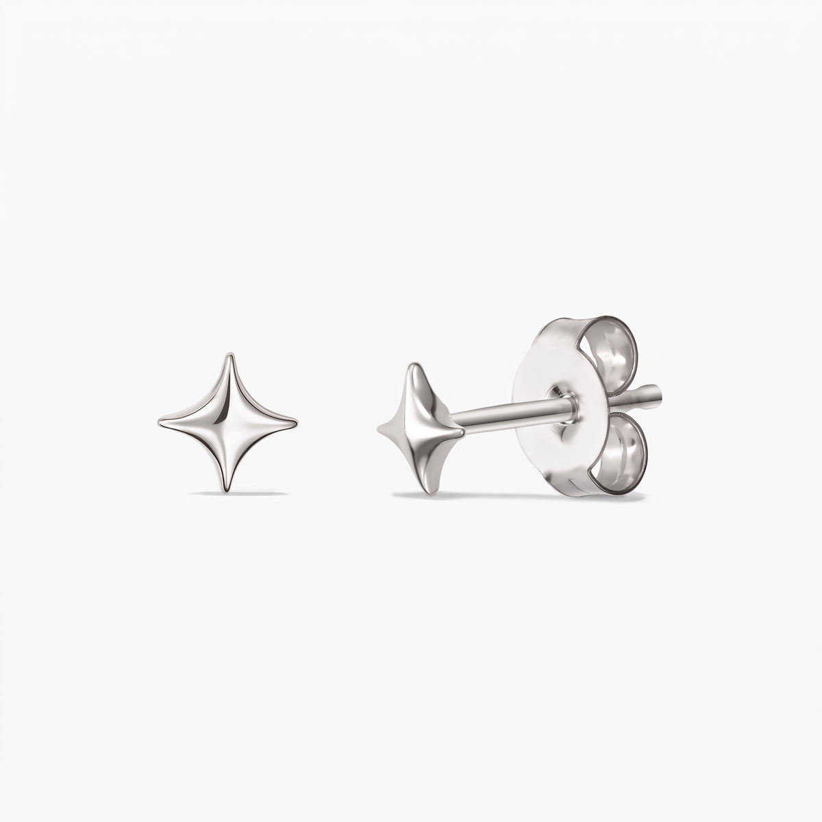 Cosmic Star Silver Earrings — a pair of 925 sterling silver star-shaped stud earrings shown front and side with butterfly backs on a white background.