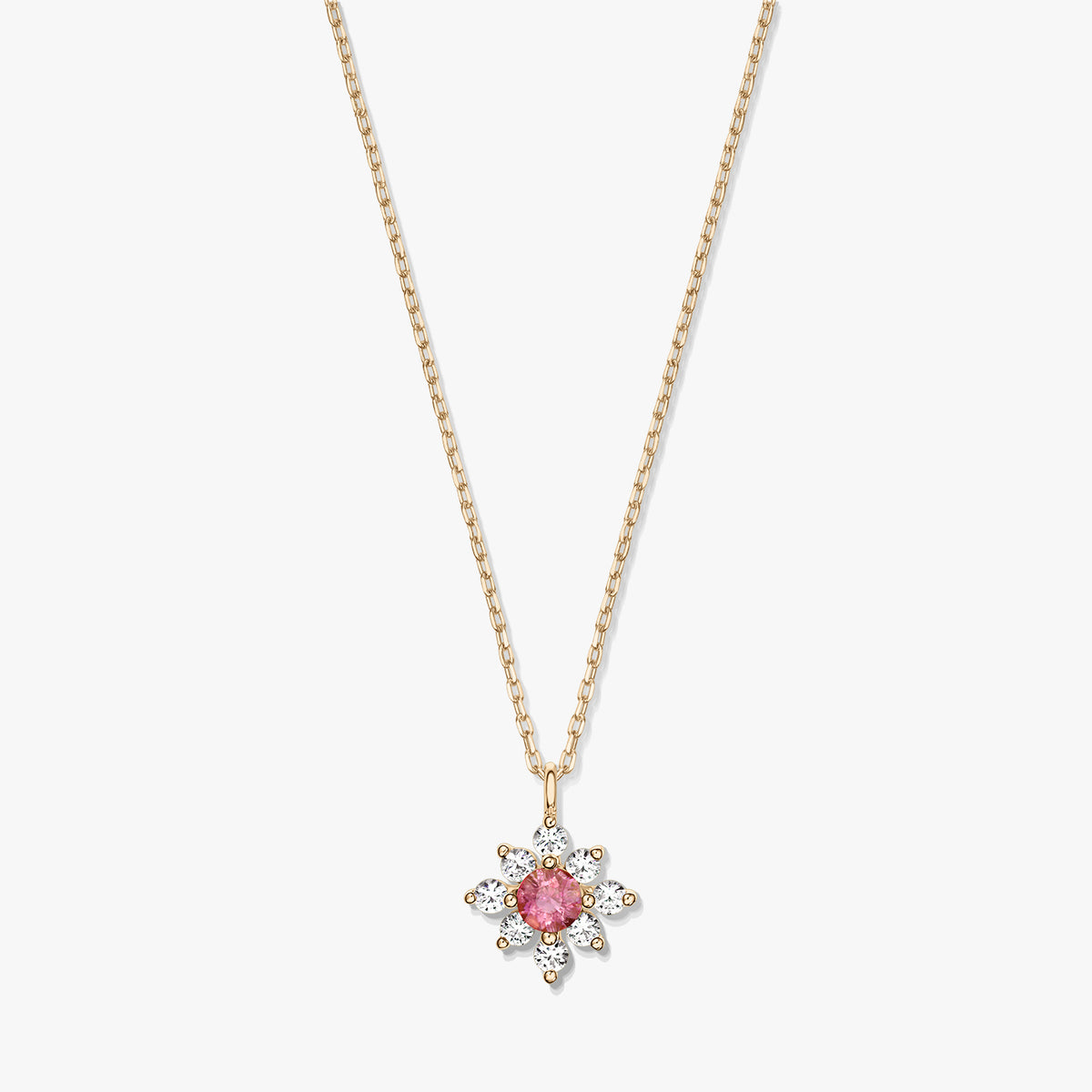 14K gold necklace with a floral pendant featuring a pink tourmaline center surrounded by white sapphires on a white background.