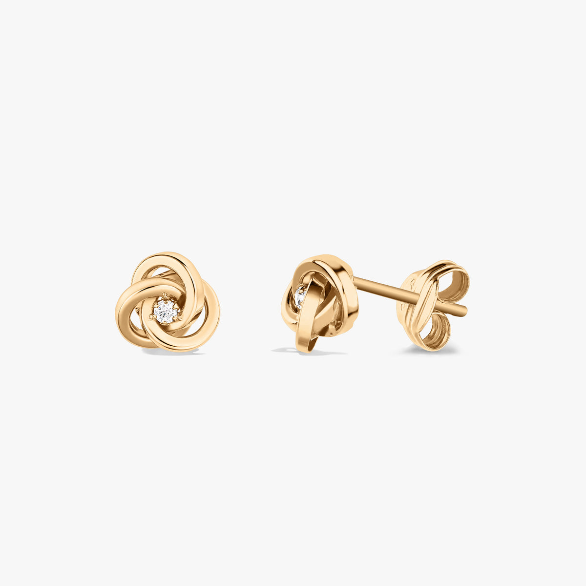 Pair of Eternal Knot gold earrings with zirconia stones on a white background.