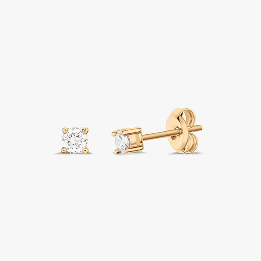 Pair of gold stud earrings each featuring a solitaire diamond, set on a white background.
