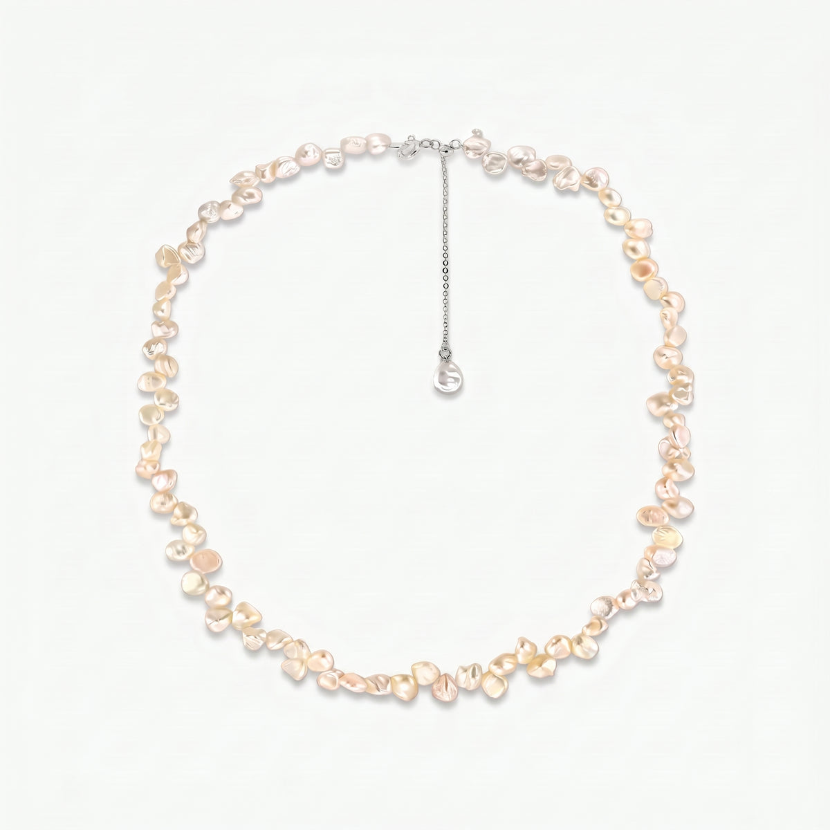 Brielle sterling silver necklace with pink keshi freshwater pearls and an adjustable extender chain on a white background.