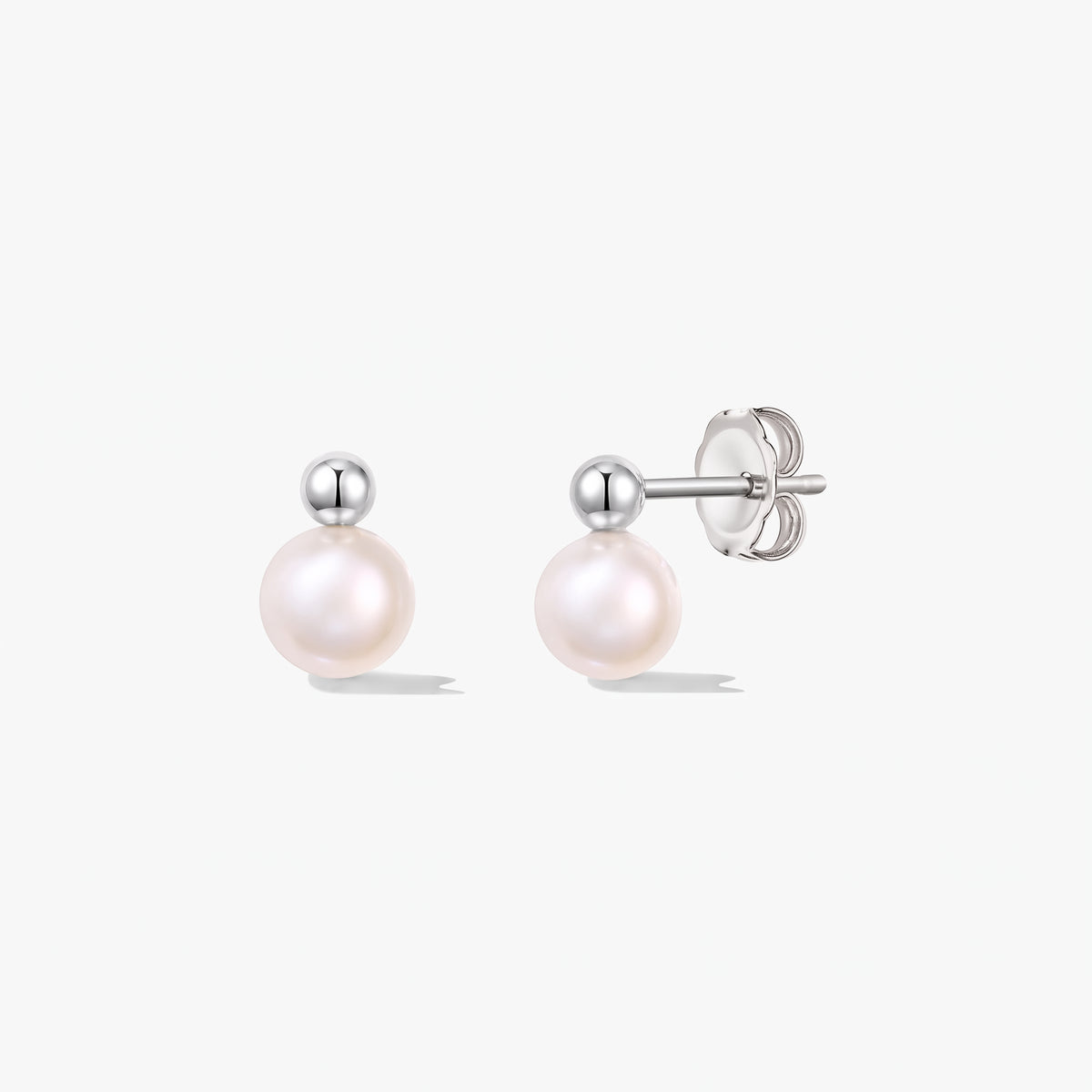 Pair of Avery sterling silver stud earrings with round cultured pearls and butterfly backs on a white background.