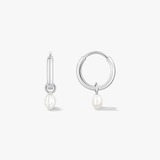 Pair of sterling silver hoop earrings with small natural pearl drops on a white background, one shown front-facing and one in side view.