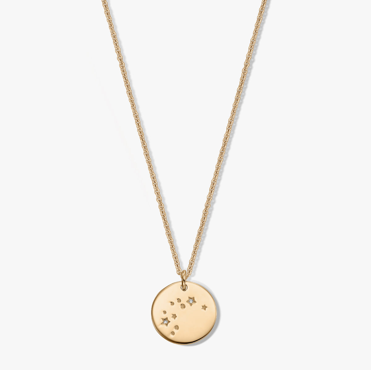 Gold‑toned round pendant necklace with the Aquarius constellation and tiny white sapphire accents on a fine chain, isolated on a white background.