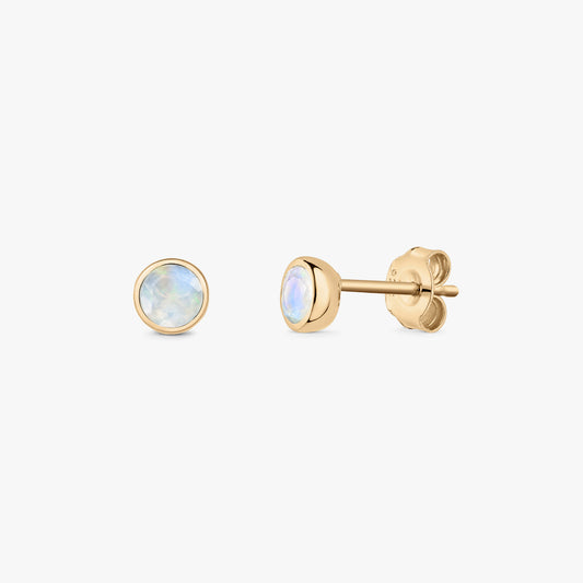 Pair of round moonstone stud earrings in gold‑plated sterling silver on a white background, shown front and side with butterfly backs.