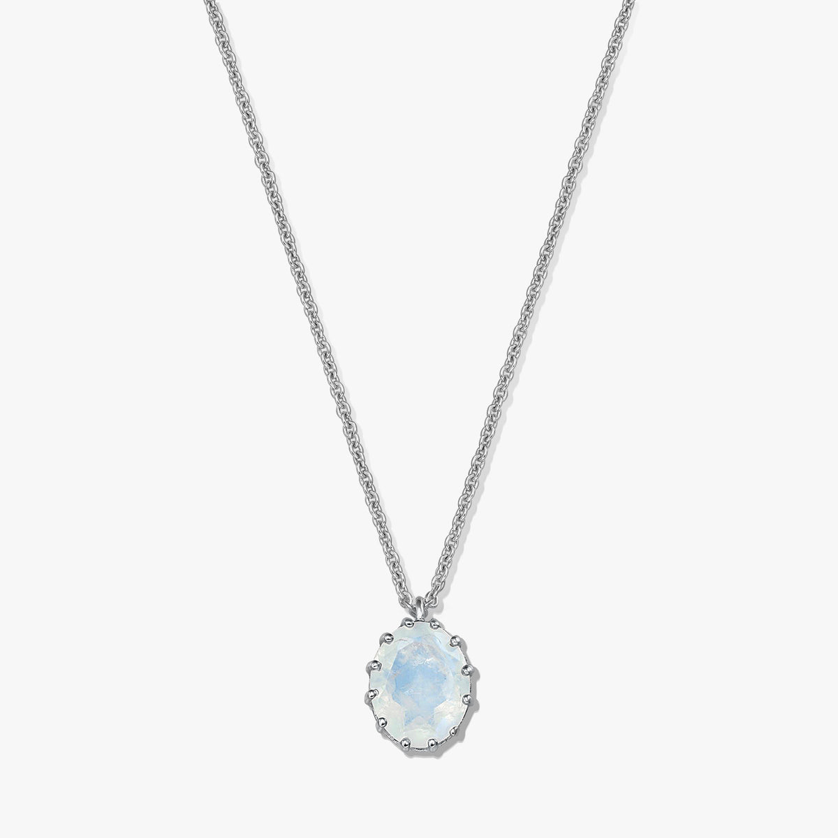 Sterling silver necklace with an oval moonstone pendant on a white background.