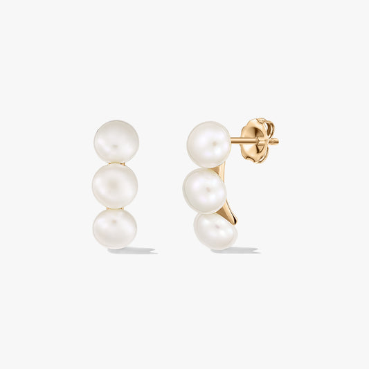 Pair of gold‑plated silver stud earrings featuring three white cultured pearls stacked vertically on each, shown on a clean white background.