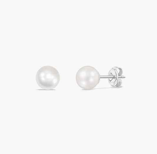 Pair of classic pearl stud earrings with natural white pearls set in 925 sterling silver on a white background.