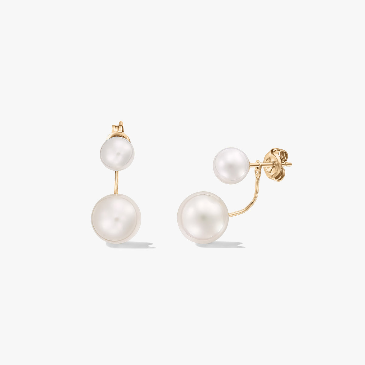Square product image of 18K yellow gold double pearl ear-jacket stud earrings with natural white pearls on a white background.