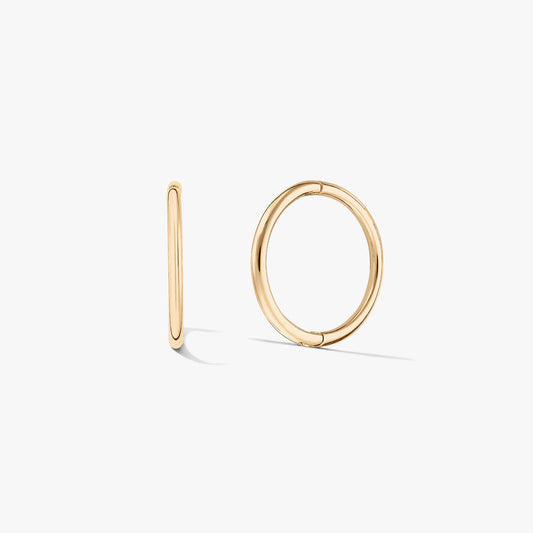 Pair of small yellow-gold hoop earrings on a white background, one shown front-facing and one in side profile.