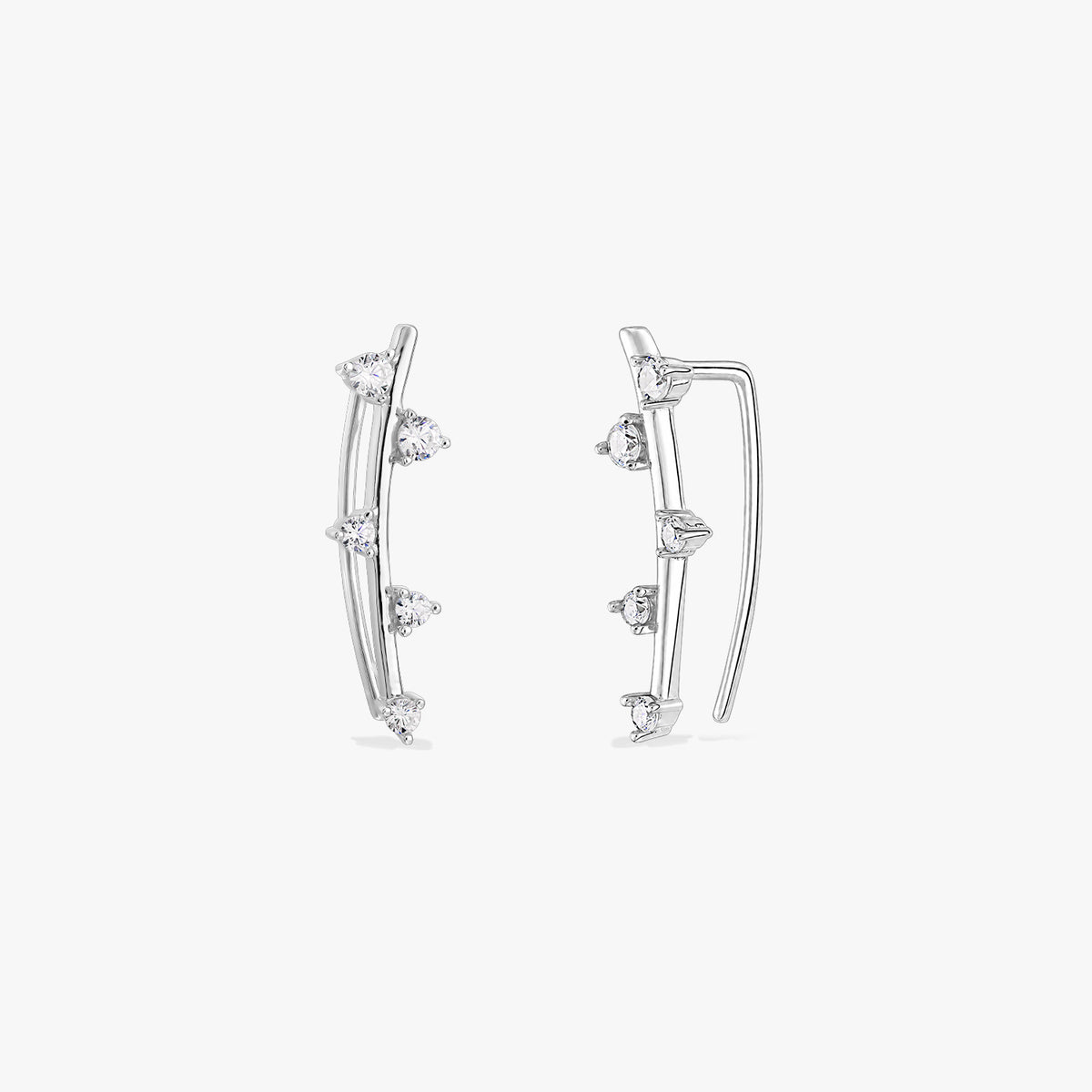 Pair of Ivy silver ear climber earrings with clear zirconia stones on a white background.