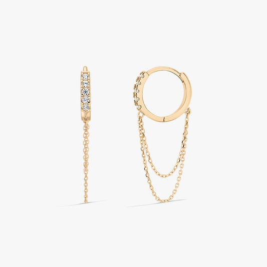 Pair of 14K yellow gold earrings with clear zirconia and fine double chains, photographed on a white background.