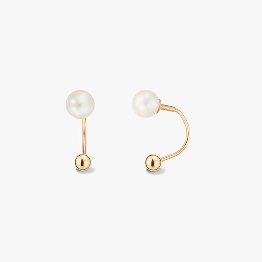 Pair of 14k yellow gold ear jacket earrings with white natural pearls on a solid white background, shown front and side to display the curved back bar.