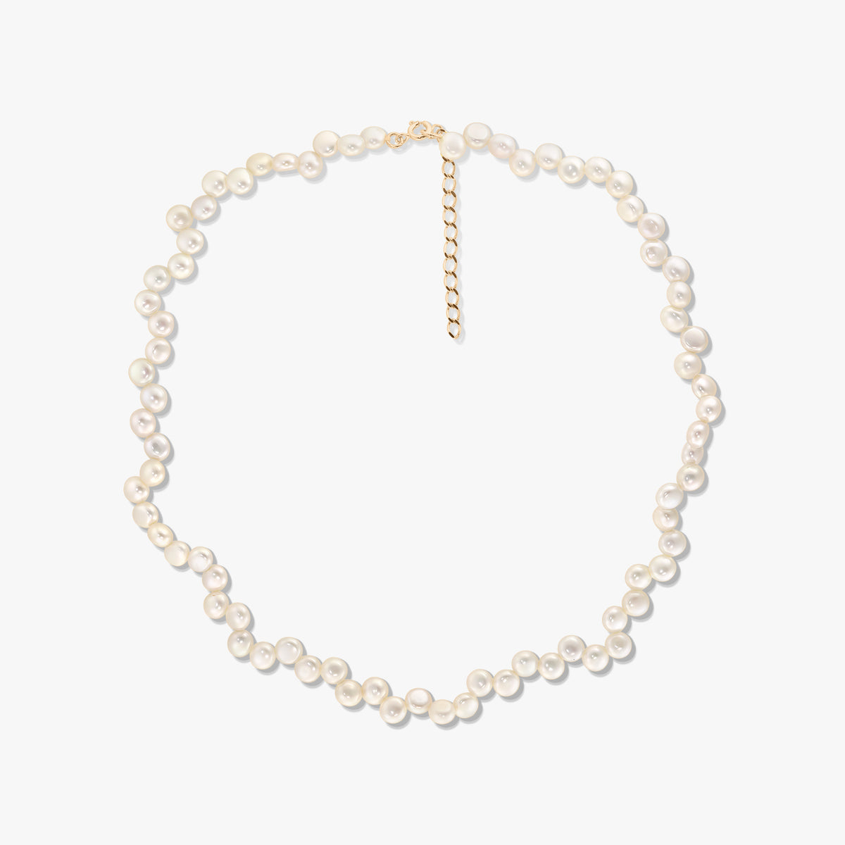 Square studio photo of a natural pearl beaded necklace with an adjustable extender chain on a white background.