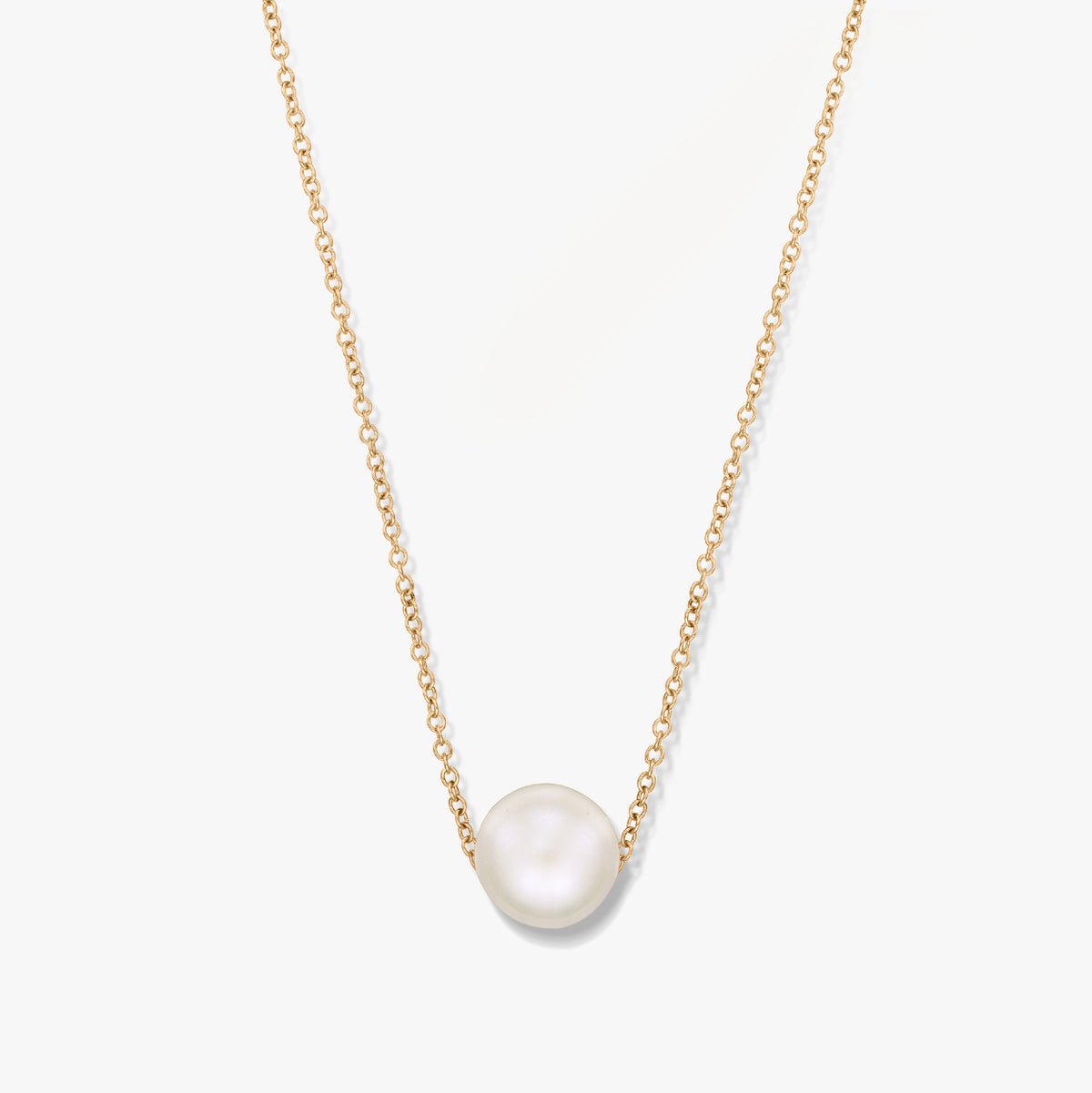 A gold necklace with a single pearl pendant on a white background.