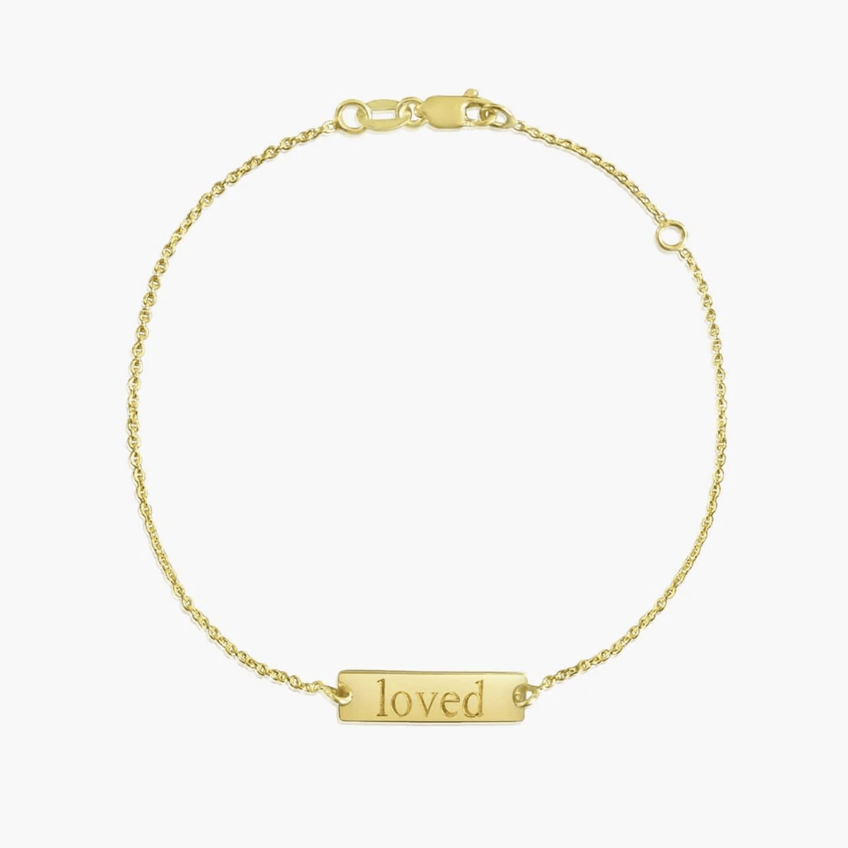 14K gold bracelet with a ‘loved’ inscription on a solid white background.