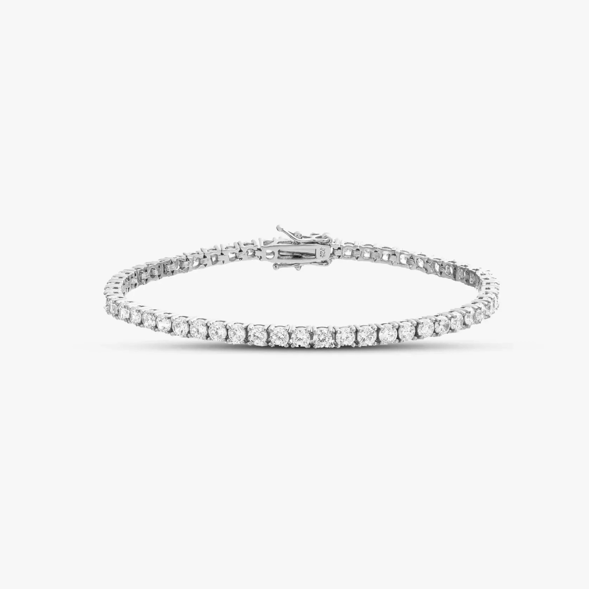 Silver tennis bracelet with zirconia stones on a solid white background.